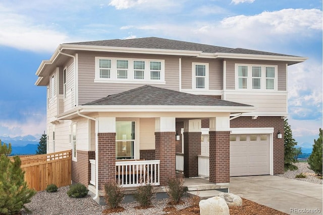 view of front facade with driveway, an attached garage, covered porch, fence, and brick siding