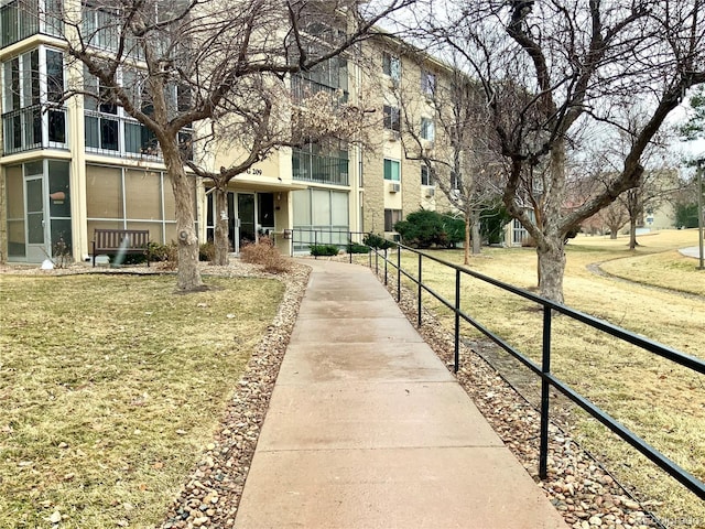 view of home's community with a yard