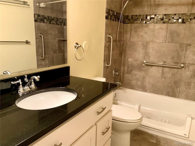 full bathroom featuring vanity, toilet, and tiled shower / bath combo