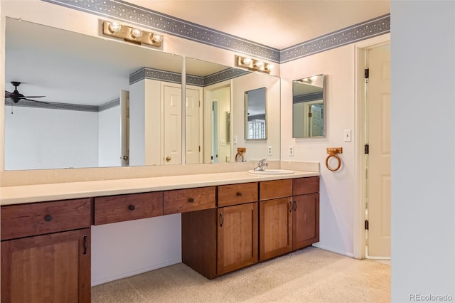 bathroom featuring vanity, ornamental molding, and ceiling fan