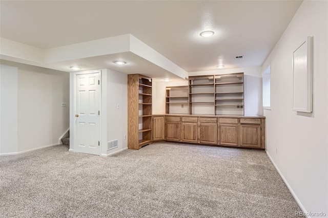 unfurnished living room with light carpet