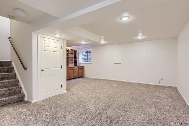 basement featuring carpet flooring