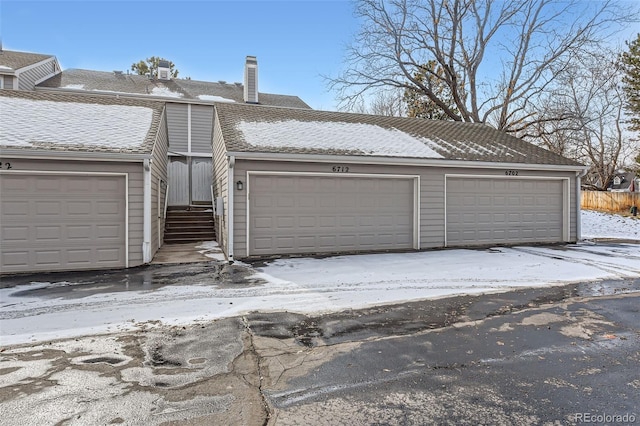 view of snow covered garage