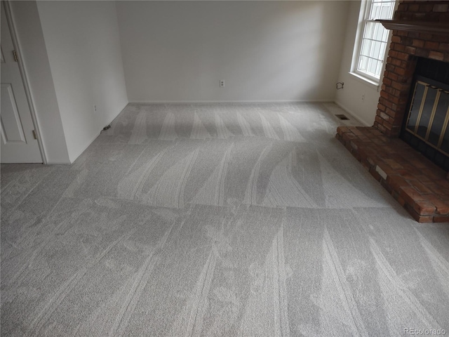 6712 E Briarwood Dr, Centennial, CO 80112 - unfurnished living room with carpet and a fireplace