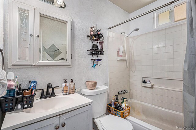 full bathroom with vanity, toilet, and shower / bath combo with shower curtain