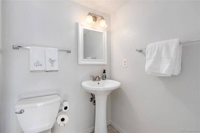 bathroom featuring sink and toilet