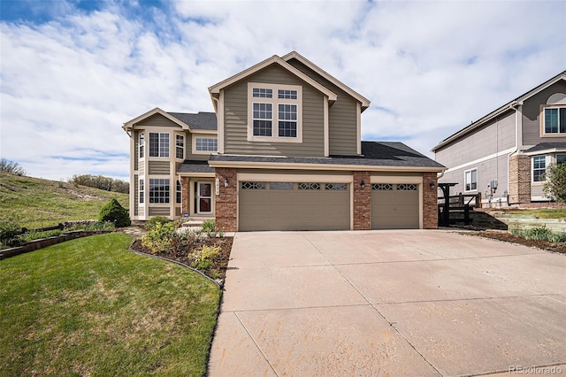 traditional-style house with brick siding, concrete driveway, a front lawn, a garage, and roof with shingles