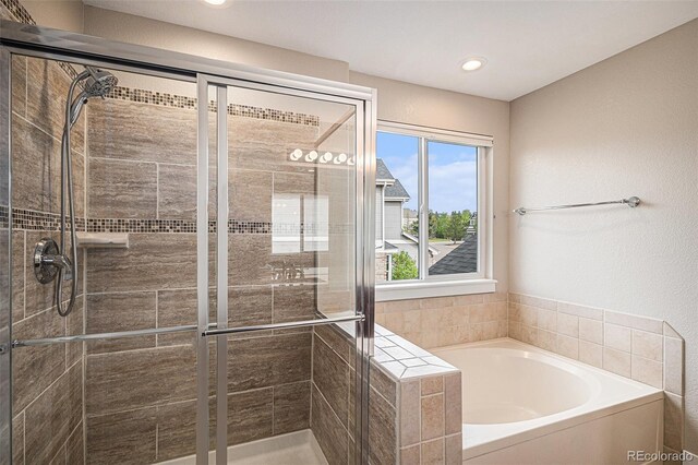 full bath with a shower stall, a garden tub, and recessed lighting