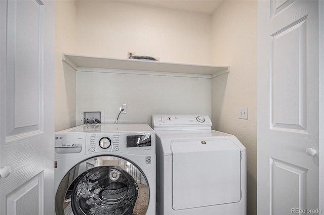 laundry area with washing machine and dryer