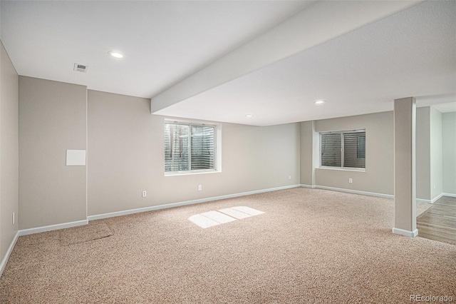 carpeted empty room featuring baseboards and recessed lighting
