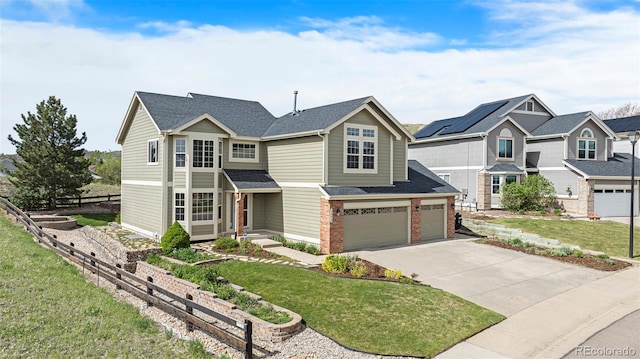 view of front of property with driveway, a garage, brick siding, a front yard, and roof with shingles
