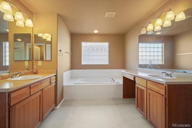 bathroom featuring a sink, visible vents, and a healthy amount of sunlight