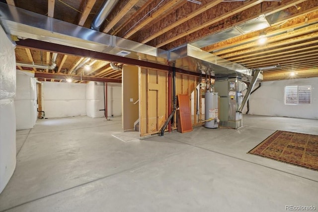 unfinished basement with gas water heater and heating unit