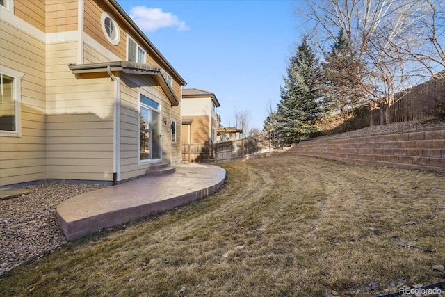 view of yard with a patio area and a fenced backyard