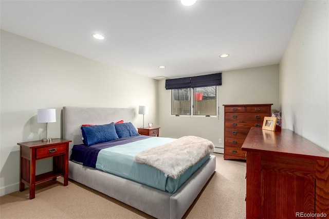 bedroom featuring light carpet, baseboard heating, and recessed lighting