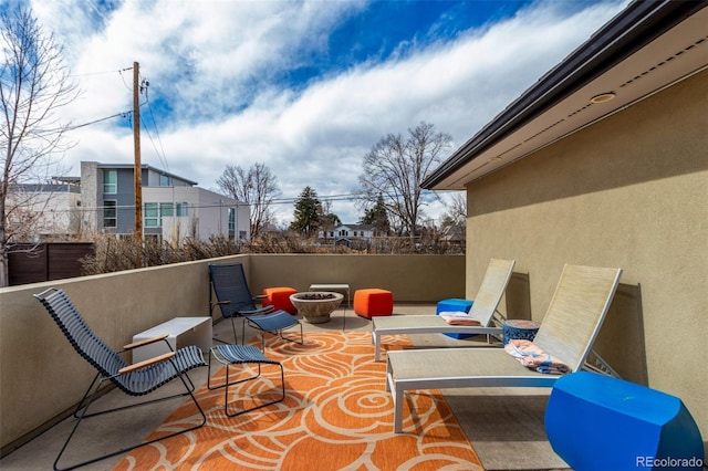 view of patio / terrace with an outdoor fire pit