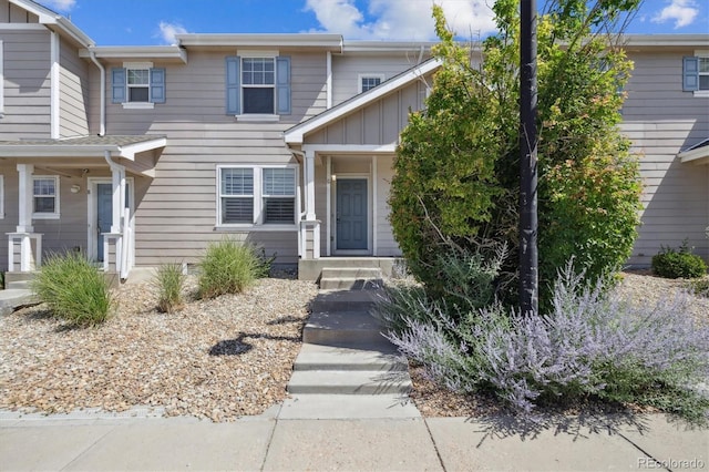 19209 E 58th Ave Unit C, Denver, CO 80249 - view of front of home featuring board and batten siding