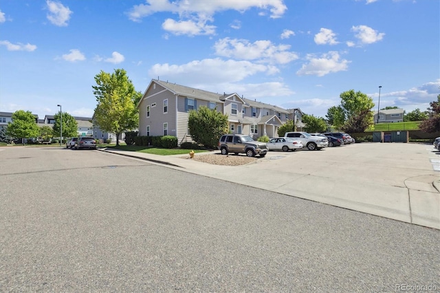 19209 E 58th Ave Unit C, Denver, CO 80249 - view of road featuring a residential view, street lighting, and curbs