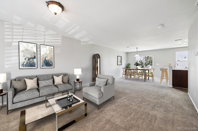 19209 E 58th Ave Unit C, Denver, CO 80249 - carpeted living room with baseboards