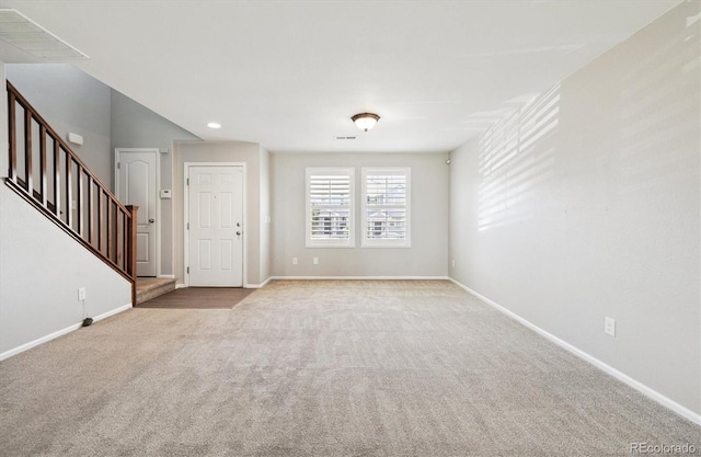19209 E 58th Ave Unit C, Denver, CO 80249 - unfurnished room featuring carpet flooring, stairs, and recessed lighting
