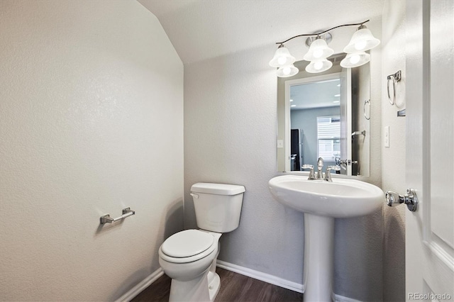 19209 E 58th Ave Unit C, Denver, CO 80249 - bathroom with wood finished floors and vaulted ceiling