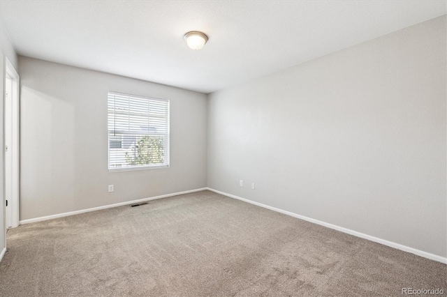 19209 E 58th Ave Unit C, Denver, CO 80249 - carpeted spare room with baseboards