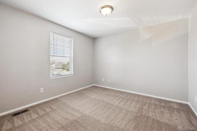 19209 E 58th Ave Unit C, Denver, CO 80249 - carpeted empty room featuring baseboards
