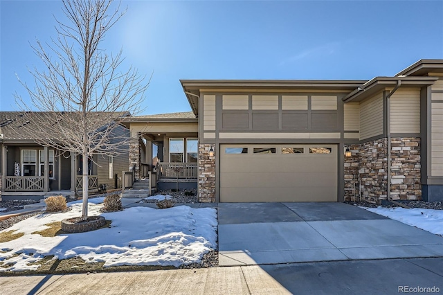 view of front of property featuring a porch and a garage