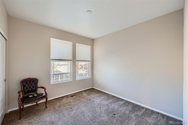 unfurnished room featuring carpet flooring