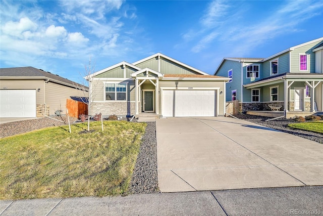 view of front of house with a garage and a front yard