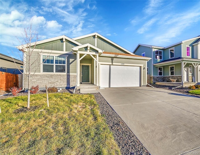 view of front of house with a garage and a front lawn