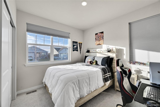 bedroom featuring light colored carpet