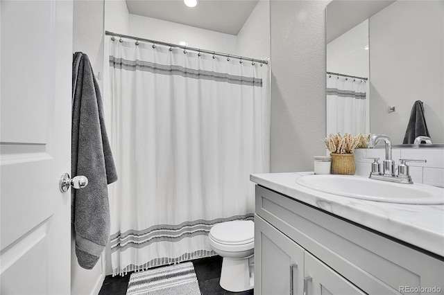 bathroom with vanity and toilet