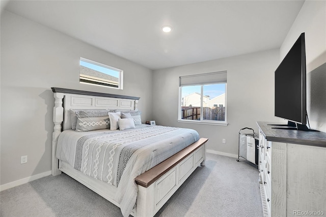 bedroom featuring light carpet