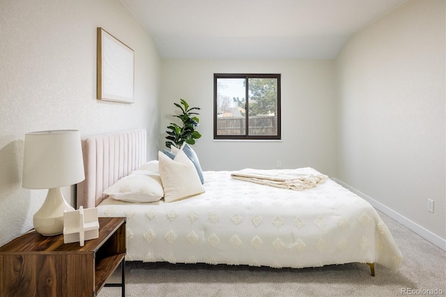 bedroom featuring baseboards and carpet flooring