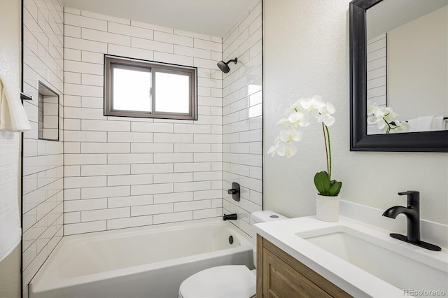 bathroom with shower / bathtub combination, toilet, and vanity