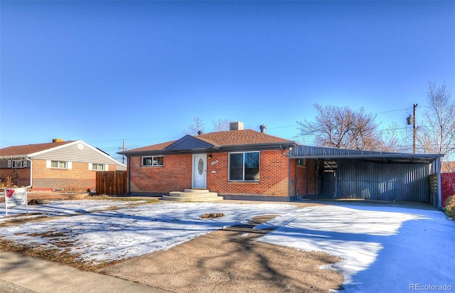 single story home featuring a carport