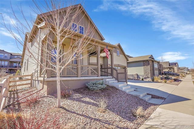 view of front of property with a residential view and a porch