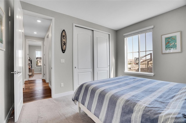 bedroom featuring recessed lighting, baseboards, a closet, and carpet floors