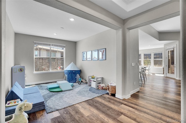 game room featuring recessed lighting, baseboards, and wood finished floors