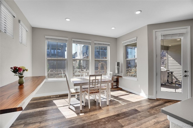 dining room with recessed lighting, wood finished floors, and baseboards