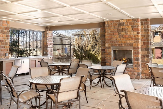 view of patio / terrace with an outdoor stone fireplace