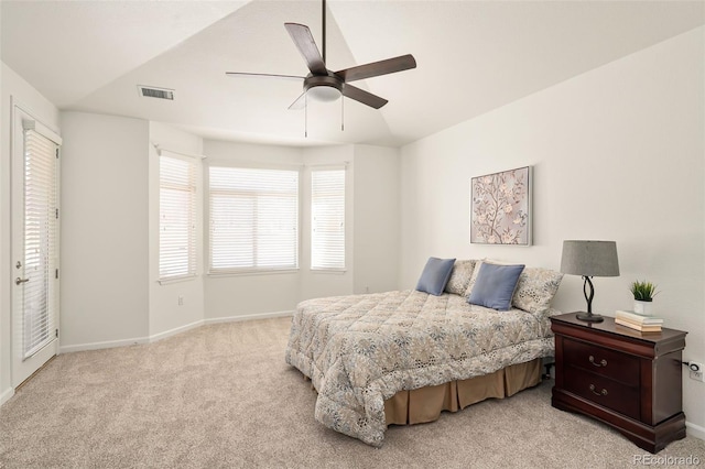 bedroom with ceiling fan and light colored carpet