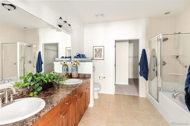 full bathroom featuring separate shower and tub, vanity, tile patterned floors, and toilet