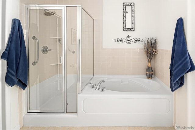 bathroom with tile patterned floors and plus walk in shower