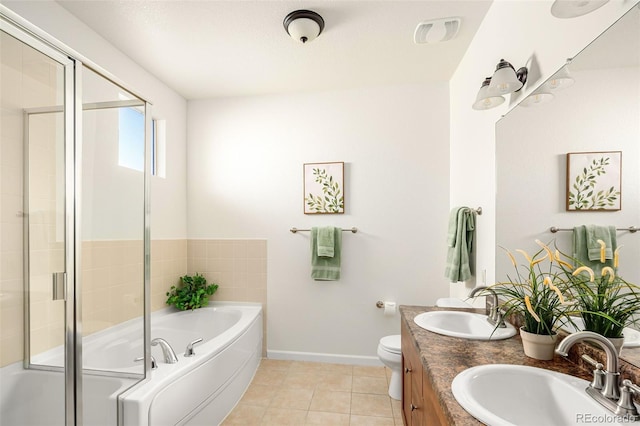 full bathroom with independent shower and bath, tile patterned flooring, vanity, and toilet