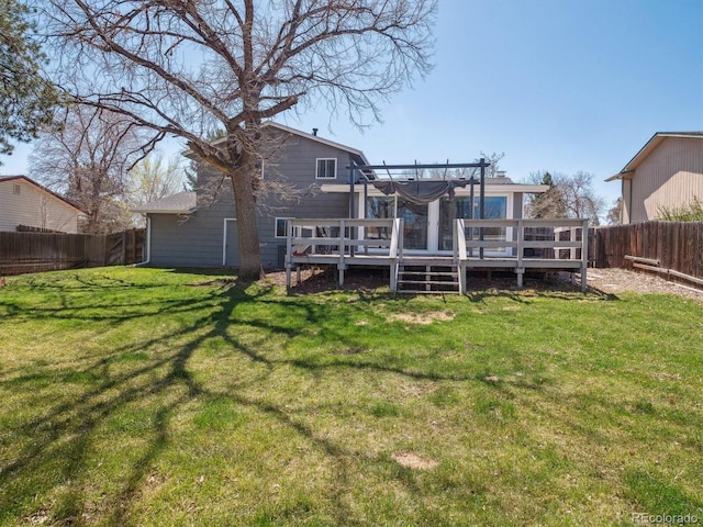5945 W Morraine Ave, Littleton, CO 80128 - rear view of house with a yard, a fenced backyard, a pergola, and a wooden deck