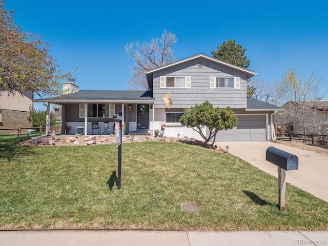 5945 W Morraine Ave, Littleton, CO 80128 - split level home featuring a front yard, an attached garage, covered porch, fence, and concrete driveway