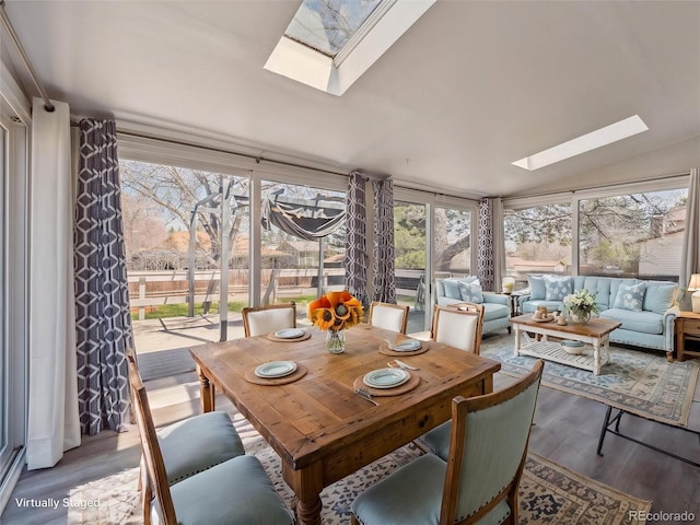 5945 W Morraine Ave, Littleton, CO 80128 - sunroom with lofted ceiling with skylight and wood finished floors