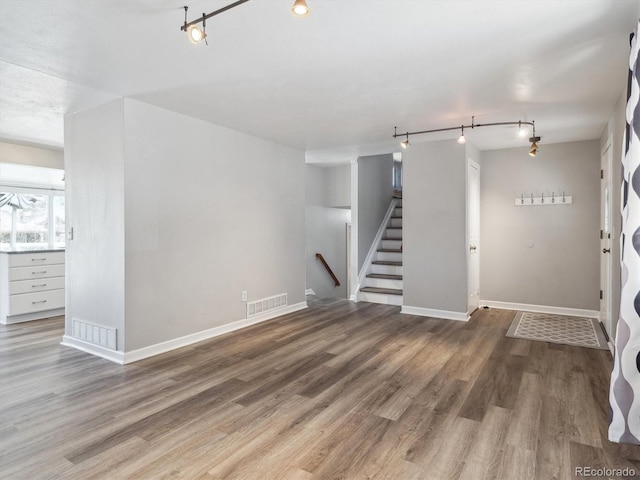 5945 W Morraine Ave, Littleton, CO 80128 - basement featuring visible vents, wood finished floors, and track lighting